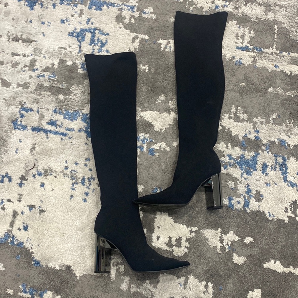 Long, over the knee socks boots with a metallic heel